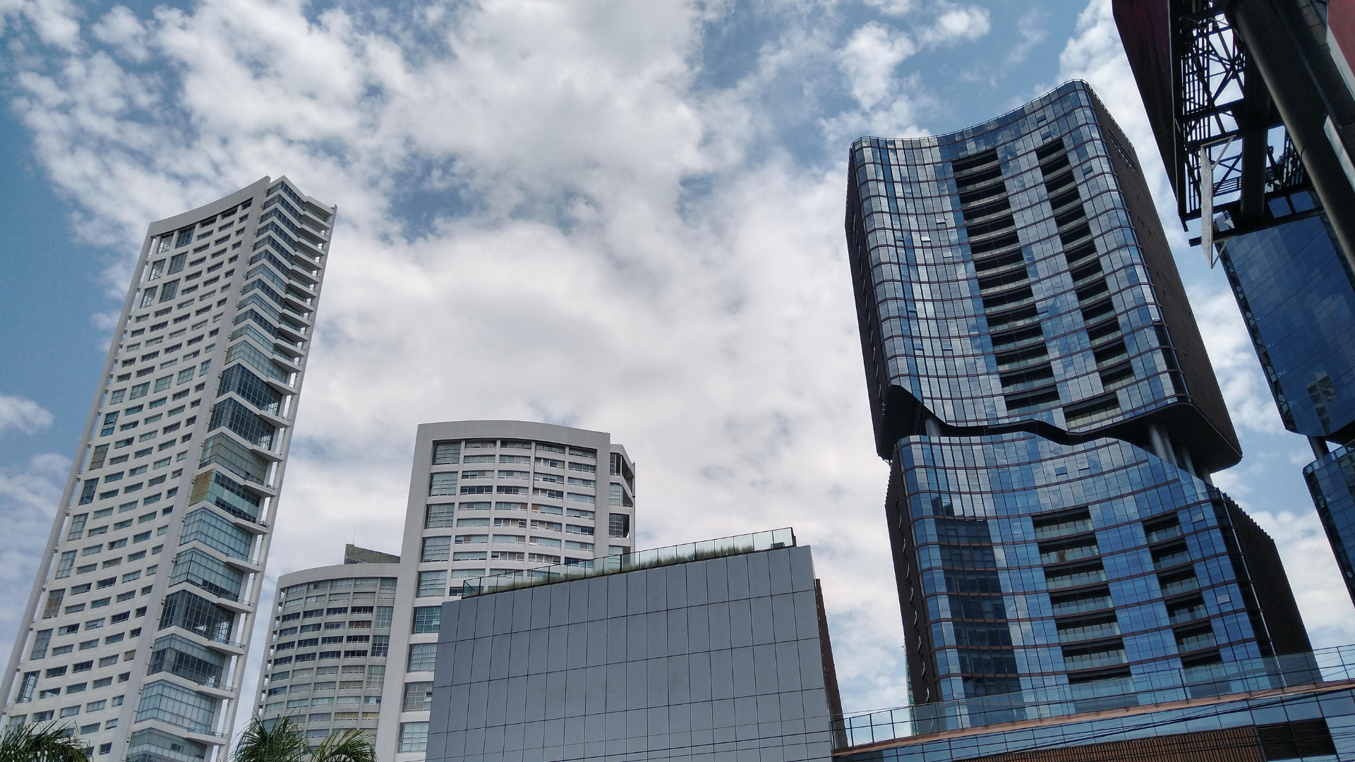 Team collaborating on laptops and whiteboard